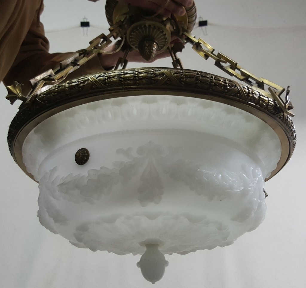 Fine Italian Carved Alabaster & Bronze Chandelier: High quality floral relief carved alabaster dome. With a detailed bronze surround and ceiling medallion. 24" diameter and would hand approx 24" from the ceiling.