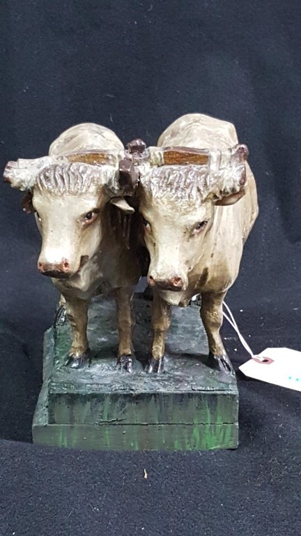 A Carved wooden pair of yoked oxen scupture: Carved painted and gessoed oxen. 8" tall x 10" long, 6.25" deep. A really nice vintage carving, posibly Swiss or Black Forest?