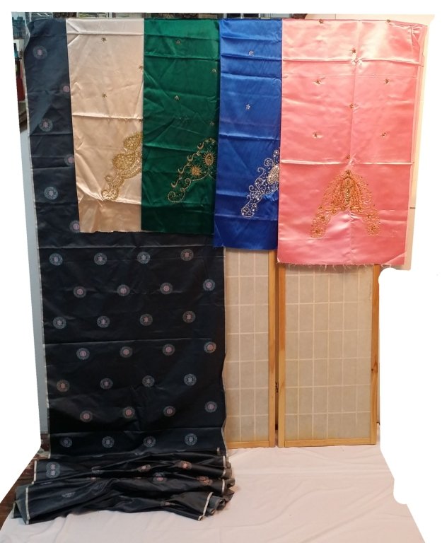 Raw Assorted Chinese silks: Yards of Green, Blue, Pink, Grey, and beige silk. With both beaded and embroidered patterns.