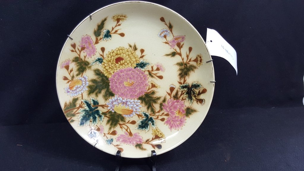 A Zsolnay Plate, 13.25": Antique floral decorated Zsolnay plate. Some crazing.