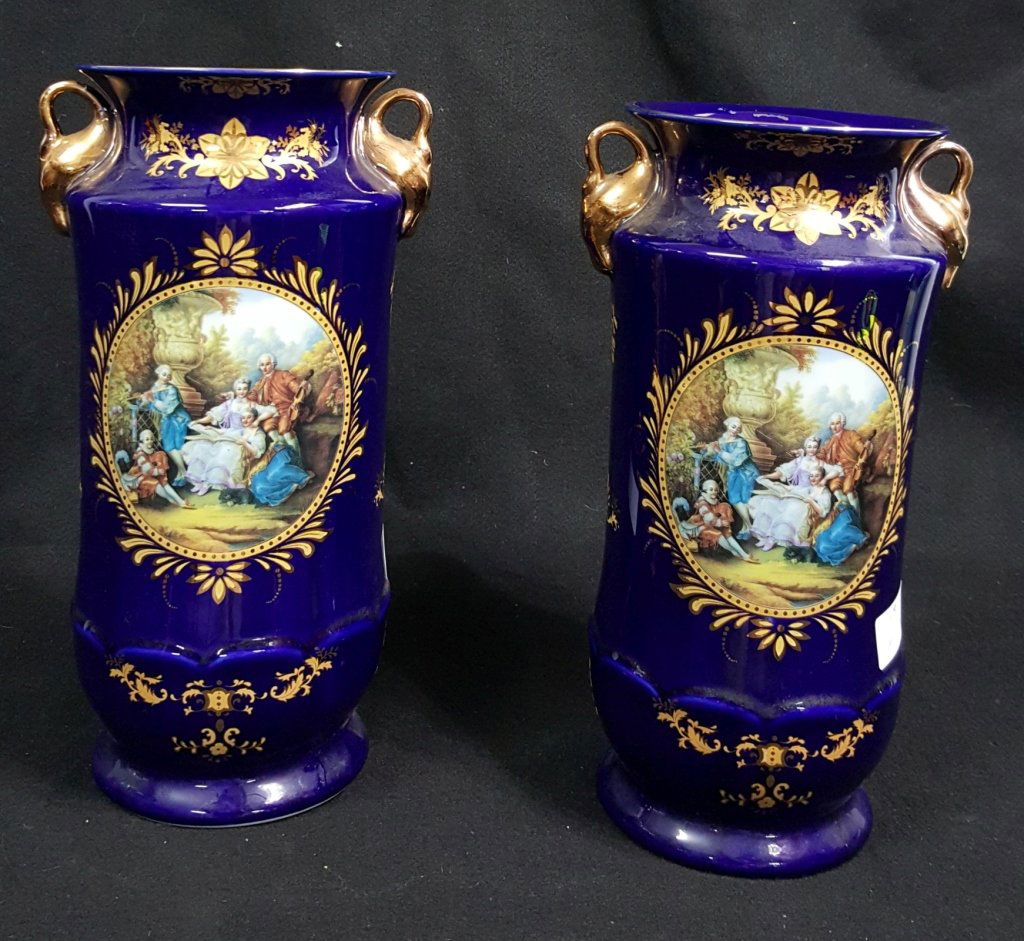 Pair of Capodimonte Swan Handled Cobalt Blue Vases: Each standing 14", one having a repaired handle. Capodimonte mark on bottom of each.