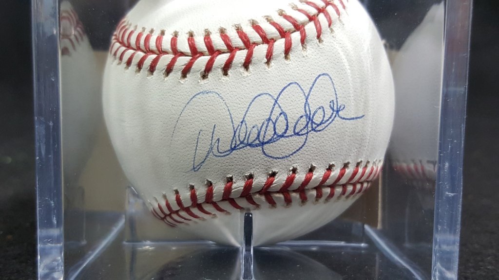 NY Yankees Derek Jeter Autographed Baseball: Hand signed by Derek Jeter on official Rawlings baseball. With certificate of authenticity.