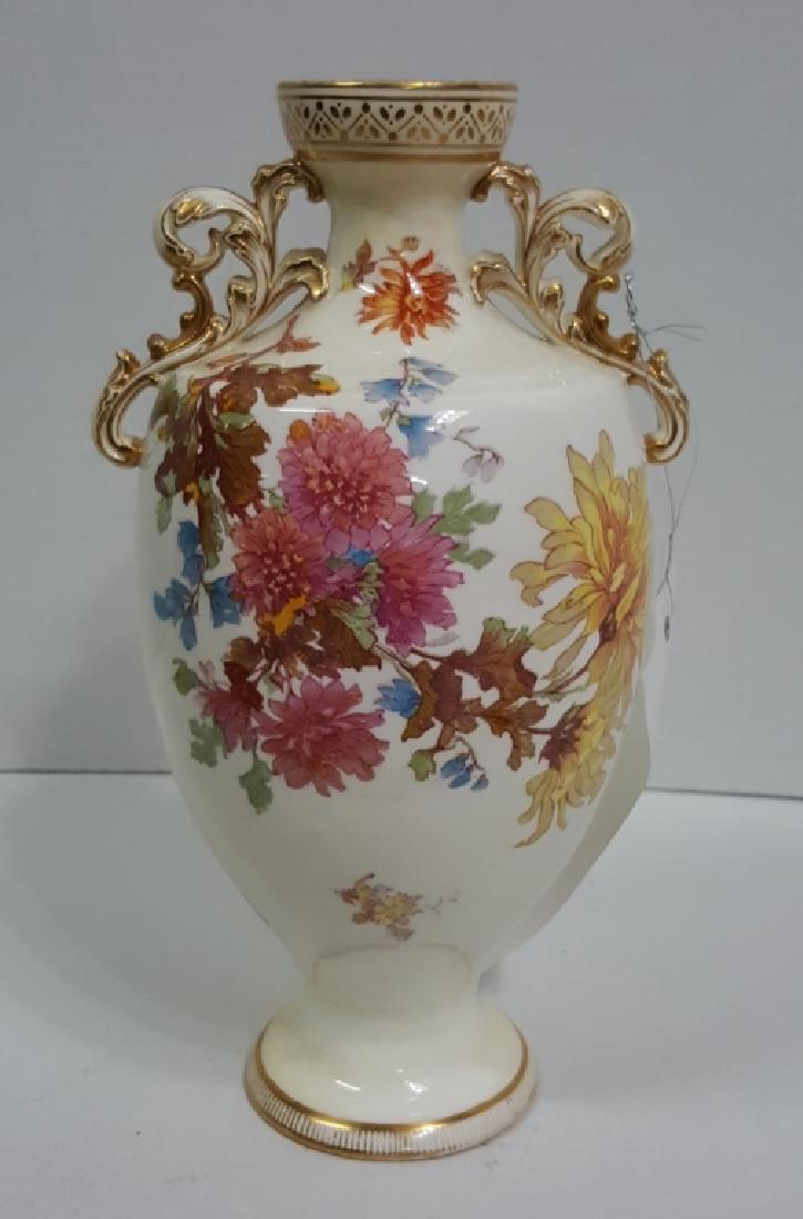 A Mintons Porcelain Vase: The vase 9.5" tall, decorated in flowers. Pink "Mintons / England" mark on base.