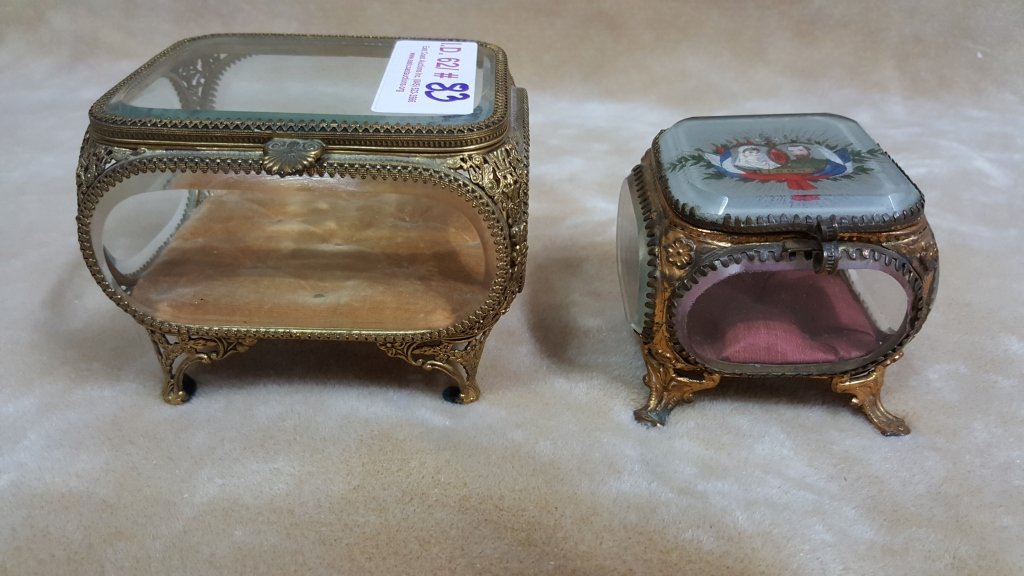Antique French Glass & Bronze Jewelry Boxes: The smaller of the two boxes has the face of a man & women and dated 1896 3" high. The Larger is 3.75" X 4" X 4.75".