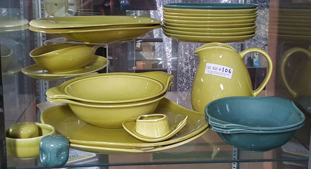 Russel Wright Pottery: A collection of the light green platters, dinner plates, gravy boats, bowls and a pitcher. Along with 2 blue bowls.