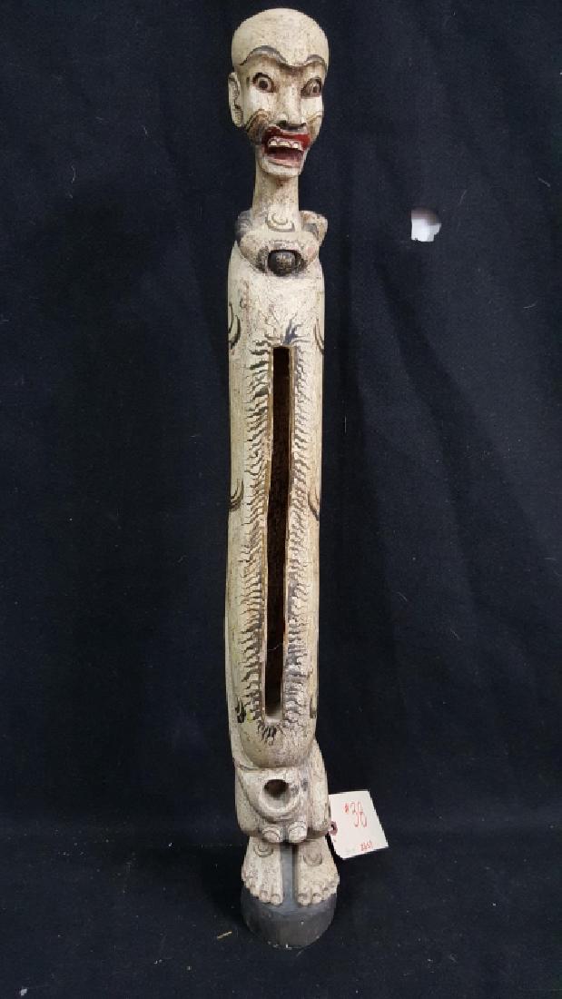 Carved Indonesian Figure. Drum figure: Probably a drum figure. Some age, not antique. 30.75" tall.