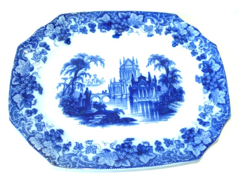 FLOW BLUE GOTHIC PATTERN PLATTER, 19TH C.: FLOW BLUE GOTHIC PATTERN PLATTER, 19TH C. 14" X 18"
