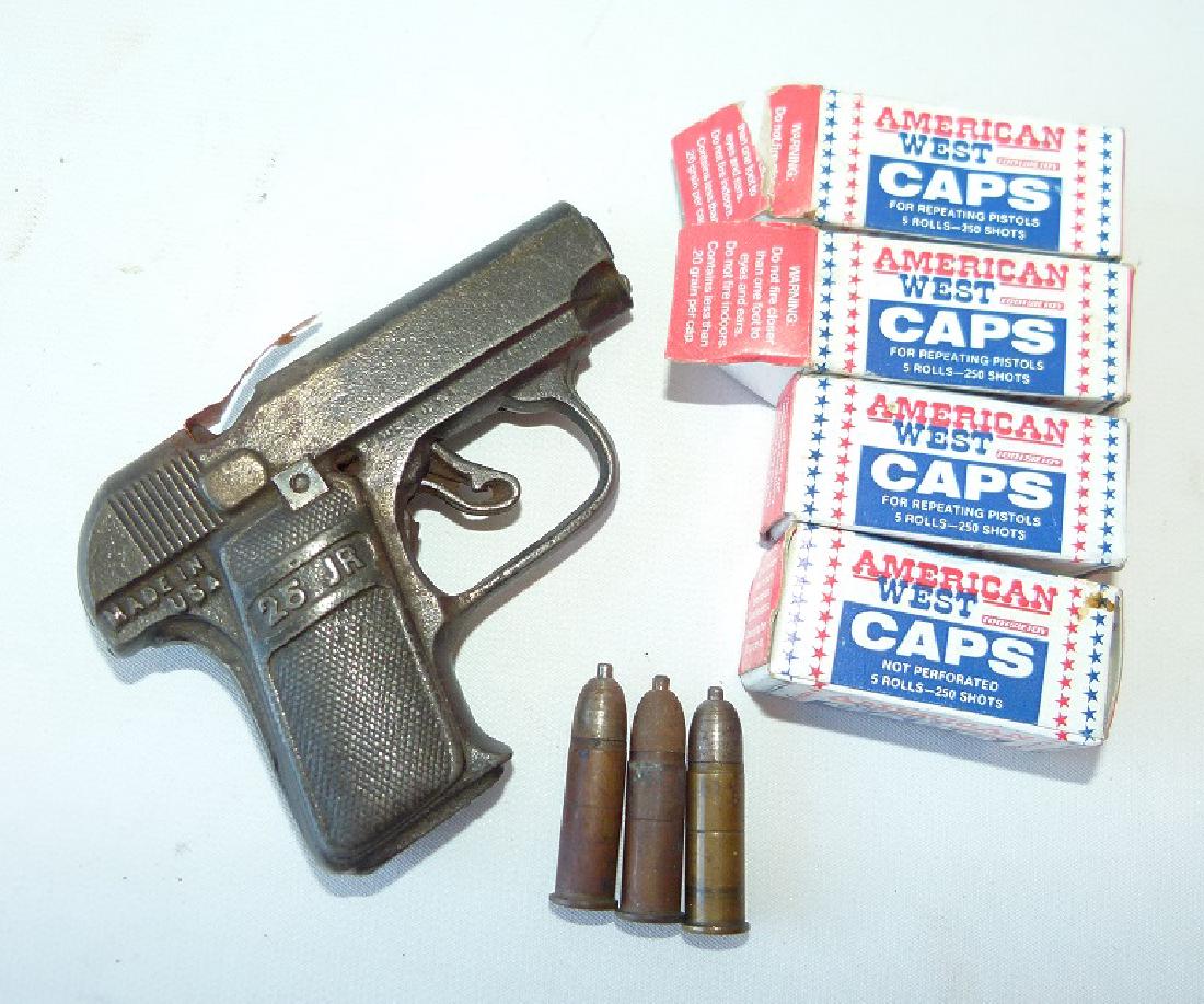 LOT INCL. 25 JR. CAST IRON CAP GUN/CAP BULLETS