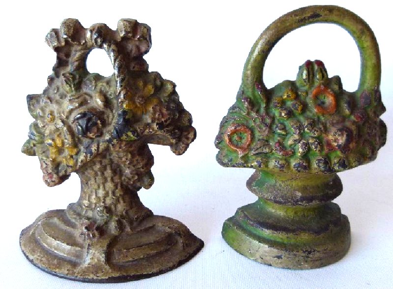 LOT (2) DECO PAINTED CAST IRON BASKET OF FLOWERS: LOT (2) DECO PAINTED CAST IRON BASKET OF FLOWERS DOORSTOPS, 19/20TH C., H. 7"