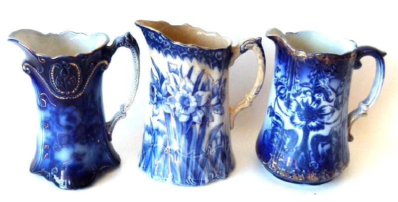 LOT (3) ASSORTED FLOW BLUE IRONSTONE MILK PITCHERS: LOT (3) ASSORTED FLOW BLUE IRONSTONE MILK PITCHERS, 19TH C. H. APPROX. 8"