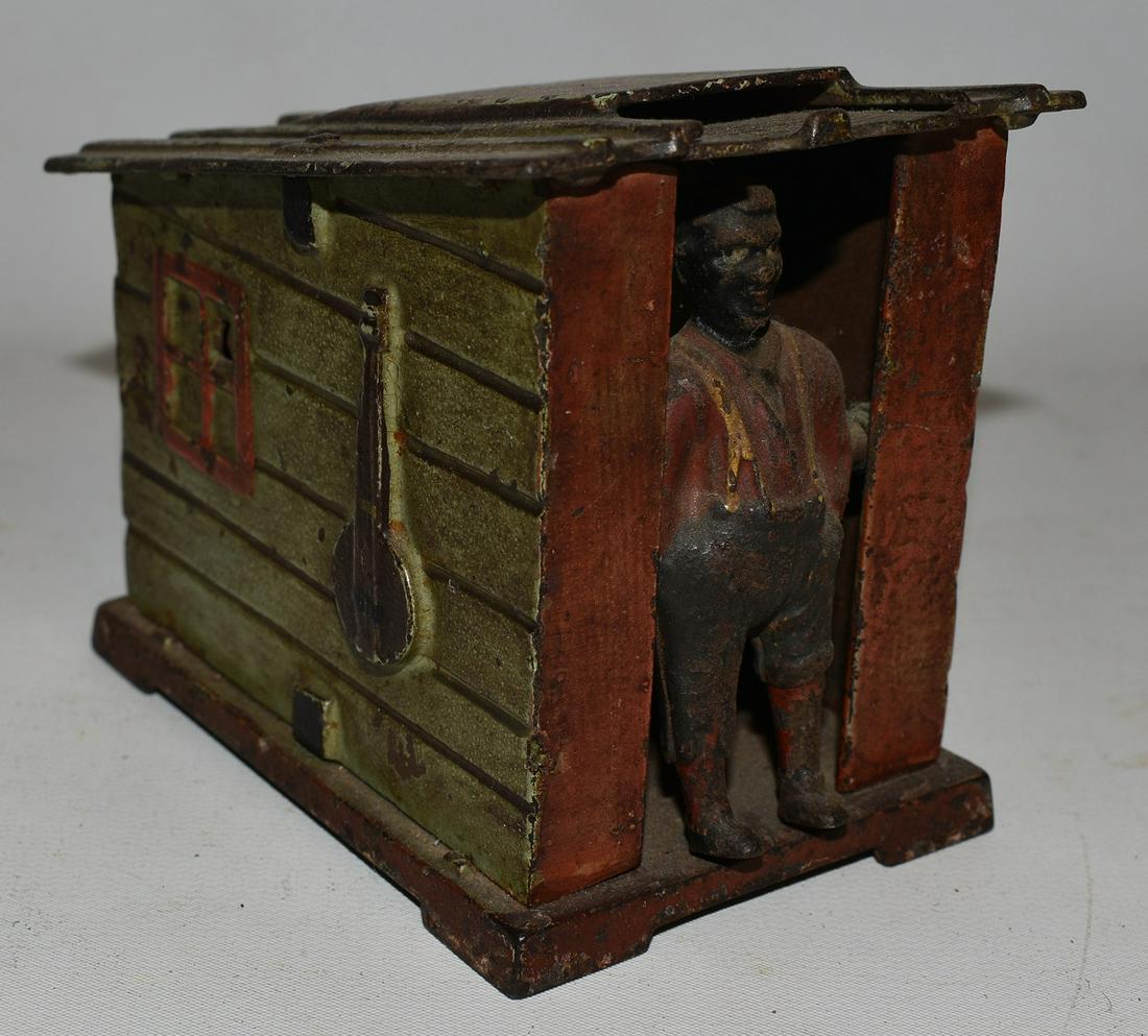 A.J.&E. STEVENS CAST IRON MECH. GREEN CABIN BANK (1 of 7)