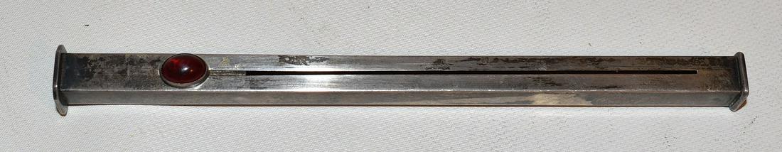 ART DECO LONDON STERLING LIP STICK SLIDE, C. 1920: ART DECO LONDON STERLING LIP STICK SLIDE W/ RED CABOCHON, HALLMARKED WILLIAM M. HAYS, C. 1907, L. 7", WEIGHT 21 GRAMS