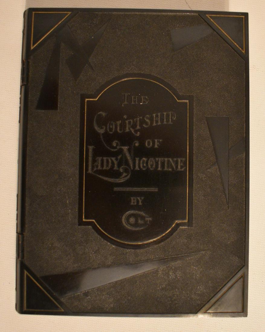 COLT FIREARMS BLACK LADY NICOTINE BOX, C. 1920: COLT FIREARMS BLACK BAKELITE LADY NICOTINE CIGARETTE BOX, C. 1920, 6 1/2" X 5