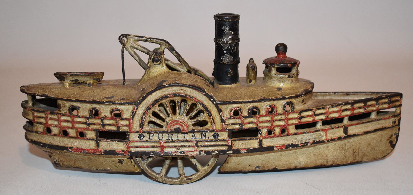 WILKENS C/I TOY PURITAN STEAMBOAT, C. 1890: FINE WILKENS CAST IRON TOY "PURITAN" PADDLE WHEEL STEAMBOAT, C. 1890 L. 10 1/2"