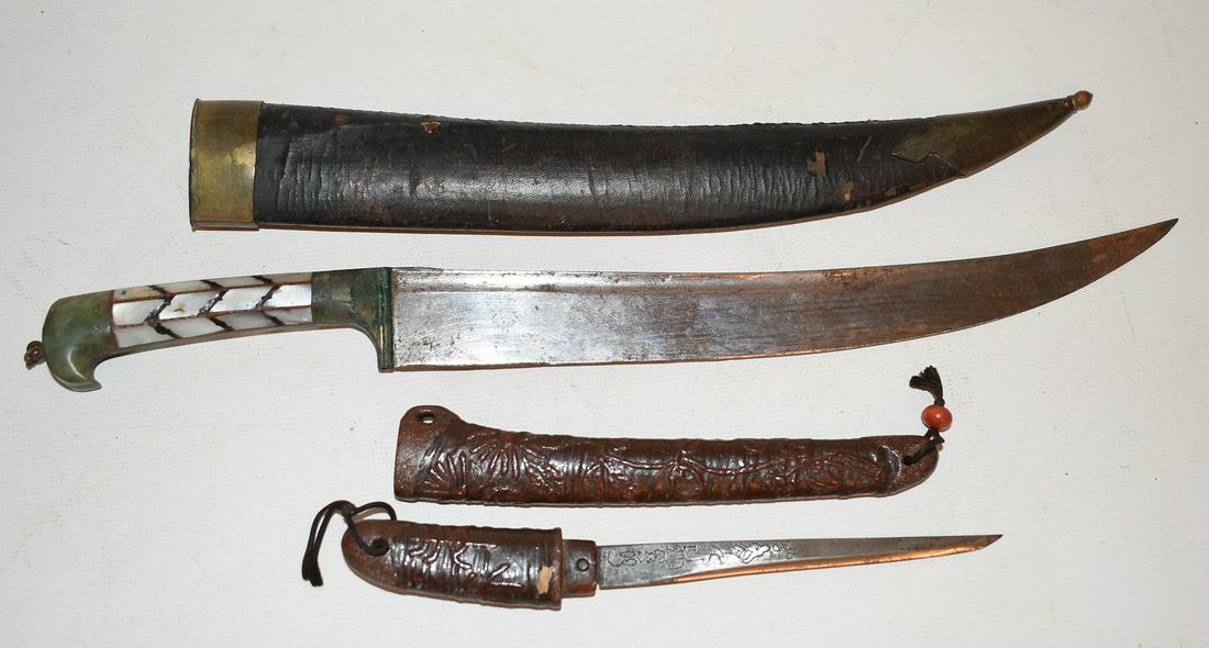LOT (2) TIBETAN DAGGERS INCL. LACQUER/JADE & ABALONE: LOT (2) TIBETAN DAGGERS INCL. LACQUER/JADE & ABALONE, 19/20TH C., L. OF LONGER DAGGER IS 12 3/4" OVERALL, 9" BLADE (NOTARIZED DOCUMENT FROM THE ESTATE OF ILYA TOLSTOY)