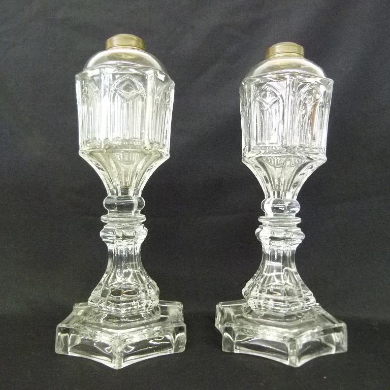 PAIR EARLY GOTHIC PATTERN GLASS WHALE OIL LAMPS: PAIR EARLY GOTHIC PATTERN GLASS WHALE OIL LAMPS, C. 1830 H. 11"