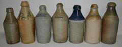 LOT (7) SALT GLAZED STONEWARE BEER/SODA BOTTLES, 19TH C.