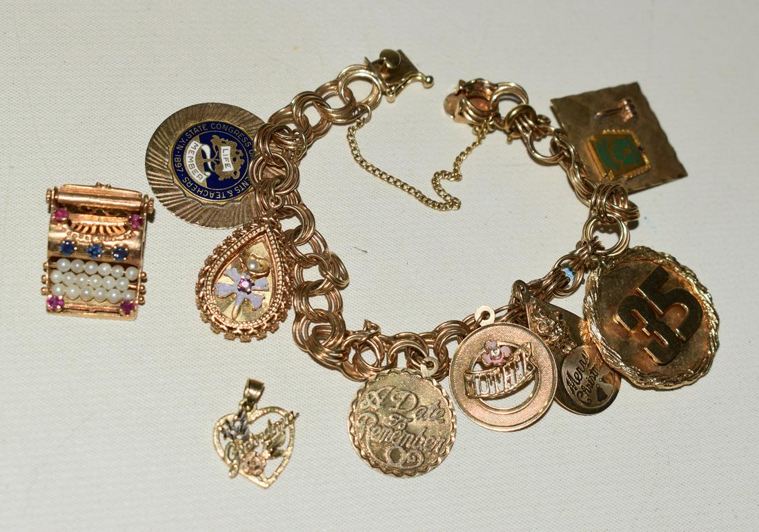 FINE DECO 14KT. YELLOW GOLD CHARM BRACELET, C. 1960'S: FINE DECO 14KT. YELLOW GOLD CHARM BRACELET, C. 1960'S, W. 28.7 DWT