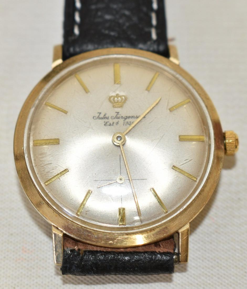 JULES JURGENSEN 14 KT. YELLOW GOLD THIN-LINE WRISTWATCH: JULES JURGENSEN 14 KT. YELLOW GOLD THIN-LINE WRISTWATCH, C. 1950/60, D. 33.13 MM