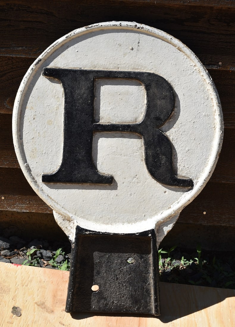 RARE CAST IRON RAILROAD R-W SIGN: RARE CAST IRON RAILROAD R-W SIGN, R=RING ENTERING TOWN, W= WHISTLE LEAVING TOWN, 19TH C., H. 20" W. 14"