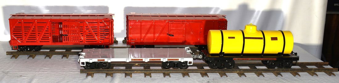 LOT (4) BUDDY L PRESSED STEEL TRAIN CARS/STOCK, 20TH C.: LOT (4) BUDDY L PRESSED STEEL TRAIN CARS/STOCK, 20TH C.