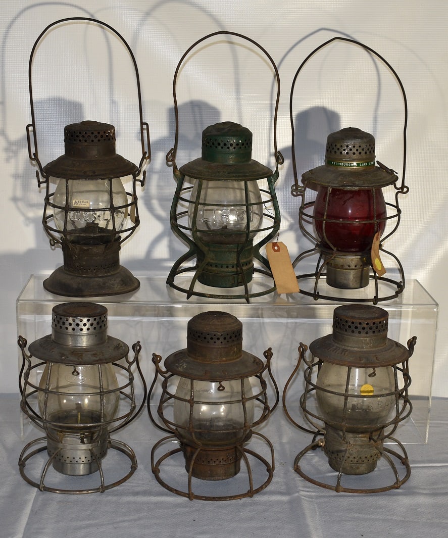 6 RR LANTERNS INCL. NY NH & H, B & LE, LIRR, NC & ST L: LOT (6) EARLY RAILROAD LANTERNS INCL. N.Y. N.H. & H., B & L.E., LIRR, N.C. & ST. L. RY., K & I.T., 19/20TH C.