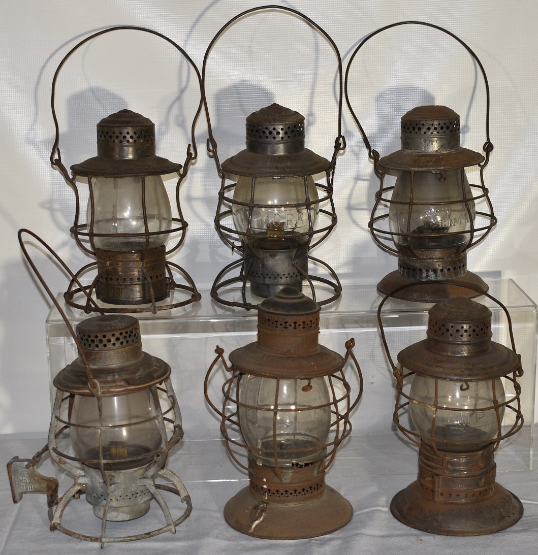 6 RR LANTERNS INCL. NY & NE, MO PAC, S. RY & CO., ERIE: LOT (6) EARLY RAILROAD LANTERNS INCL. NY & NE, MO PAC, S. RY. & CO., ERIE, M.C., NY CENTRAL, 19/20TH C.