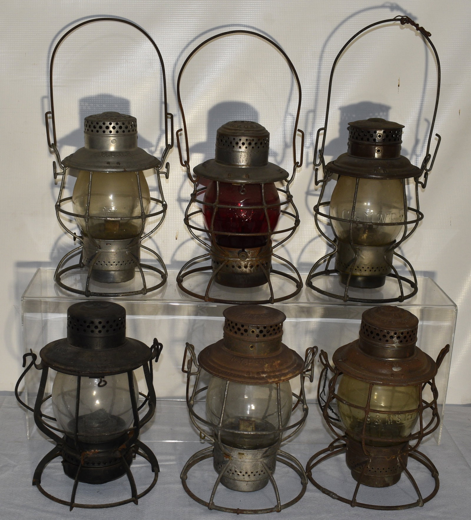 6 EARLY RR LANTERNS INCL. M.C., U & D, NY P & N RY. C: LOT (6) EARLY RAILROAD LANTERNS INCL. M.C.RR, U & D RR, NY P & N, NY P & N RY. CO., L.S. & M.S. RY., C & N.W. RY., 19/20TH C.