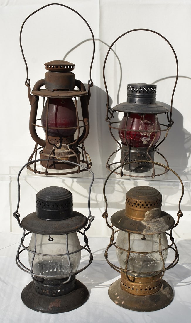 4 N.Y.C. RR LANTERNS INCL. RED/CLEAR ETCHED/CAST GLOBES: LOT (4) NEW YORK CENTRAL RAILROAD LANTERNS INCL. RED & CLEAR ETCHED/CAST GLOBES