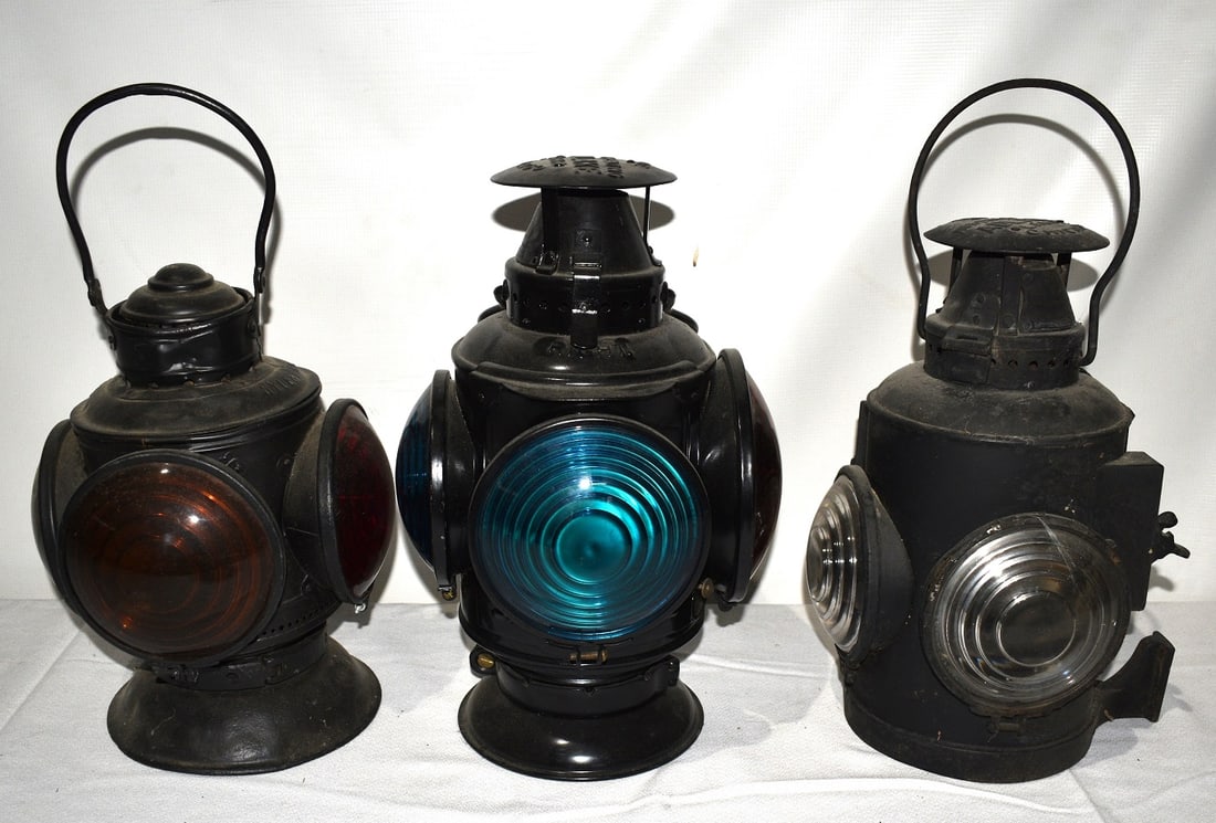 3 EARLY RR SWITCH LANTERNS, NYLE & WRR, CRR OF NJ, OSL: LOT (3) EARLY RAILROAD SWITCH LANTERNS, N.Y.L.E. & W.R.R, C.R.R. OF NJ, O.S.L., 19TH C., H. 15"