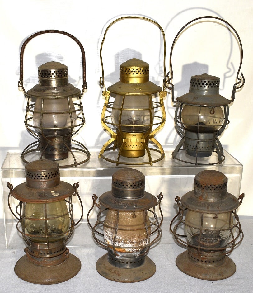 6 EARLY RR LANTERNS INCL. OSL, ICRR, NY CENTRAL, PRR: LOT (6) EARLY RAILROAD LANTERNS INCL. O.S.L., I.C.R.R., NY CENTRAL, P.R.R., L.S.E. RY., 19/20TH C.