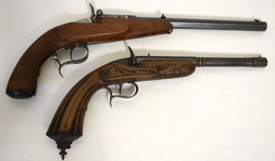 LOT (2) SPANISH CARVED SINGLE SHOT PISTOLS, 19TH C.: LOT (2) SPANISH CARVED SINGLE SHOT PISTOLS, 19TH C., L. 18 (LONGEST)