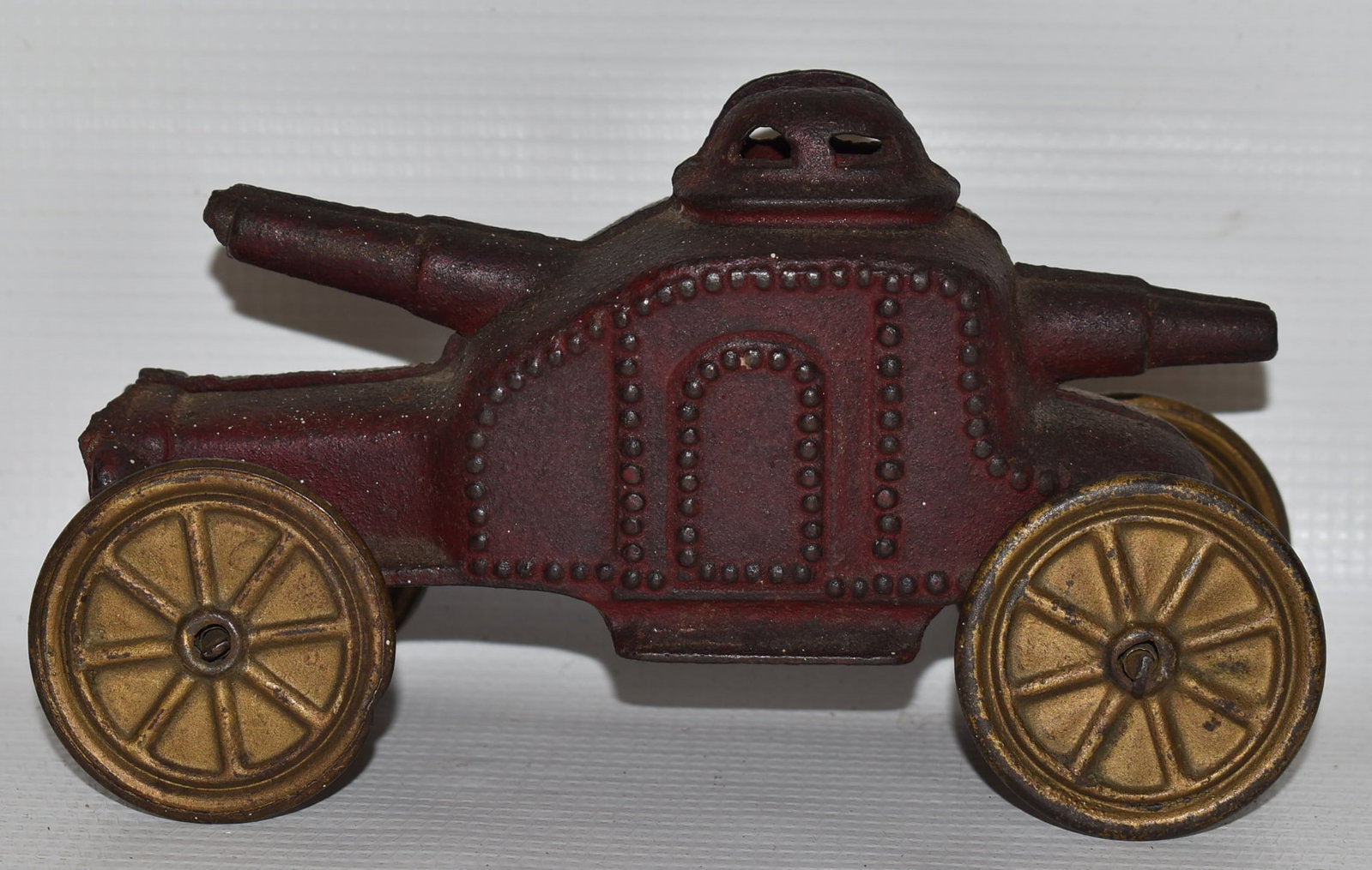 RARE ARMORED CAR PENNY STILL BANK (ORIG. PAINT): RARE ARMORED CAR PENNY STILL BANK (ORIG. PAINT) C. 1905/10, L. 7" (SMALL FRACTURE BY REAR GUN)