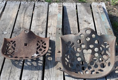LOT (2) CAST IRON TRACTOR SEATS