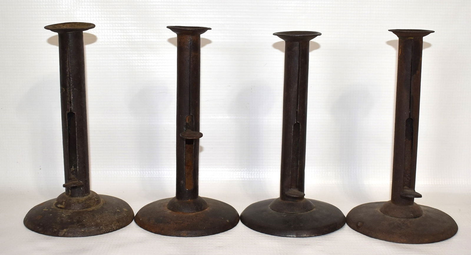 4 EARLY AMERICAN IRON HOGSCRAPER CANDLESTICKS, 19TH C. (1 of 6)