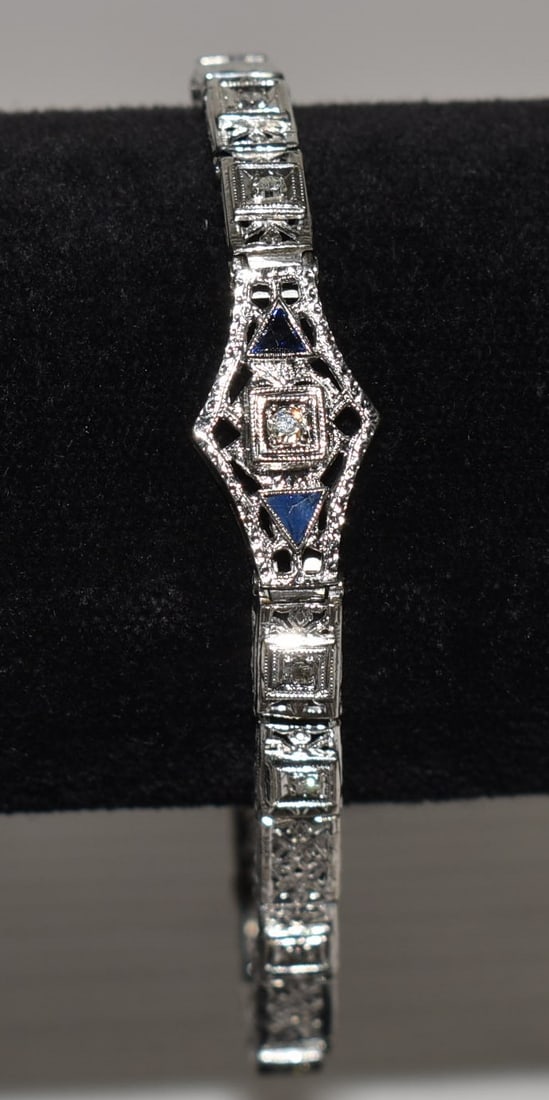 ART DECO 14KT WH. GOLD/DIAM./SAPPHIRE FILIGREE BRACELET: ART DECO 14KT WHITE GOLD/DIAMOND & SAPPHIRE FILIGREE BRACELET, C. 1920, L. 6 3/4", W. 5.1 DWT