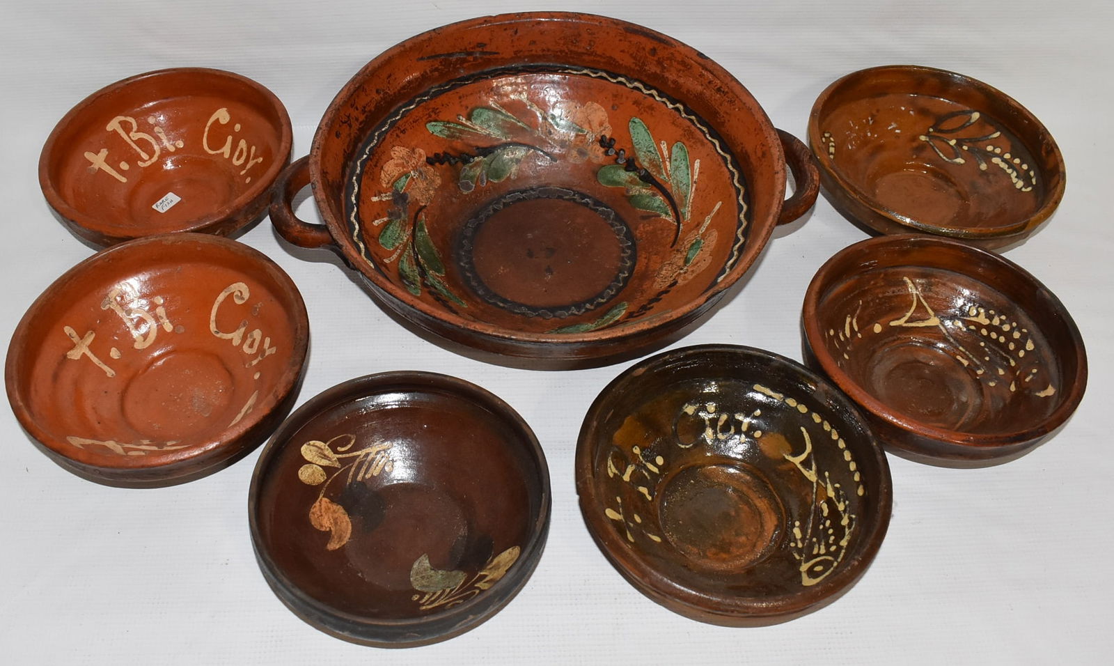 LOT (7) ASSORTED DECORATIVE REDWARE BOWLS, 20TH C.: LOT (7) ASSORTED DECORATIVE REDWARE BOWLS, 20TH C., LARGEST 4" X 12"