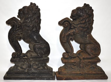 (2) VICTORIAN CAST IRON SEATED LION DOORSTOPS, 19TH C.