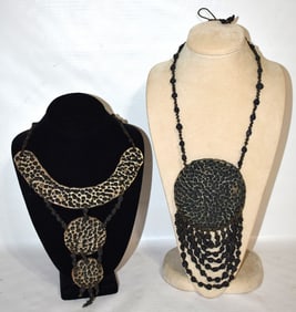 (2) RARE CHARLIE BROWN SCULPTED CLAY NECKLACES, C. 1970