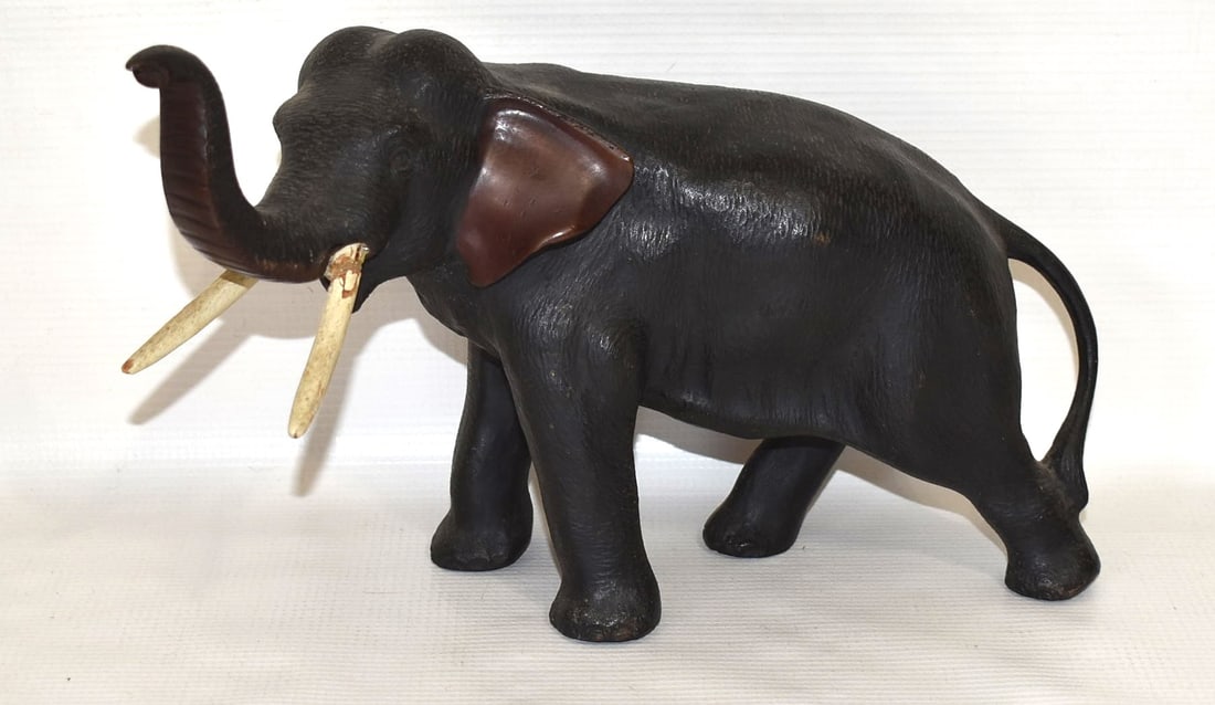 DECO COLD PAINTED BRONZE ELEPHANT DOOR STOP, C. 1920: DECO COLD PAINTED BRONZE ELEPHANT DOOR STOP, C. 1920, H. 6 1/2" L. 11" (1 TUSK REPAIRED)