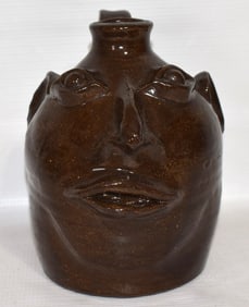 CONTEMPORARY STONEWARE FACE JUG, 20TH C., H. 7"
