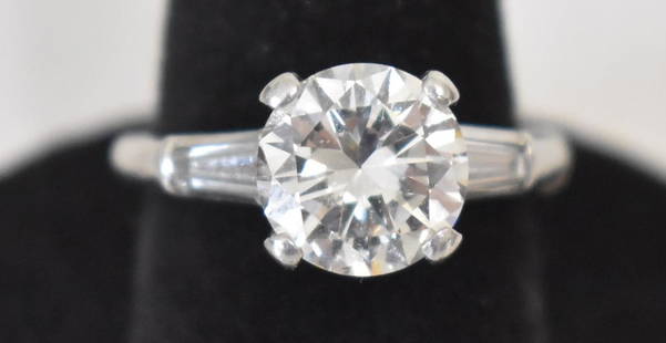 PLATINUM DIAMOND ENGAGEMENT RING W/2.35 CT CENTER STONE: FINE ART DECO PLATINUM DIAMOND ENGAGEMENT RING W/2.35 CT CENTER STONE W/2 ELONGATED BAGUETTES APPROX. .50 CTS, C. 1960, W. 3.6 DWT
