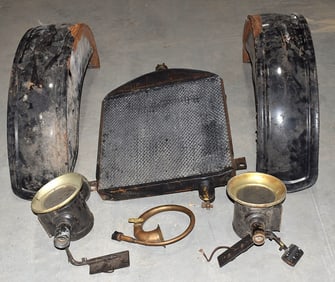 ASST. MODEL T PARTS INCL. HEAD LAMPS, FENDERS, RADIATOR