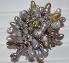 EXCEPTIONAL ART DECO 18KT WHITE GOLD COAT BROOCH