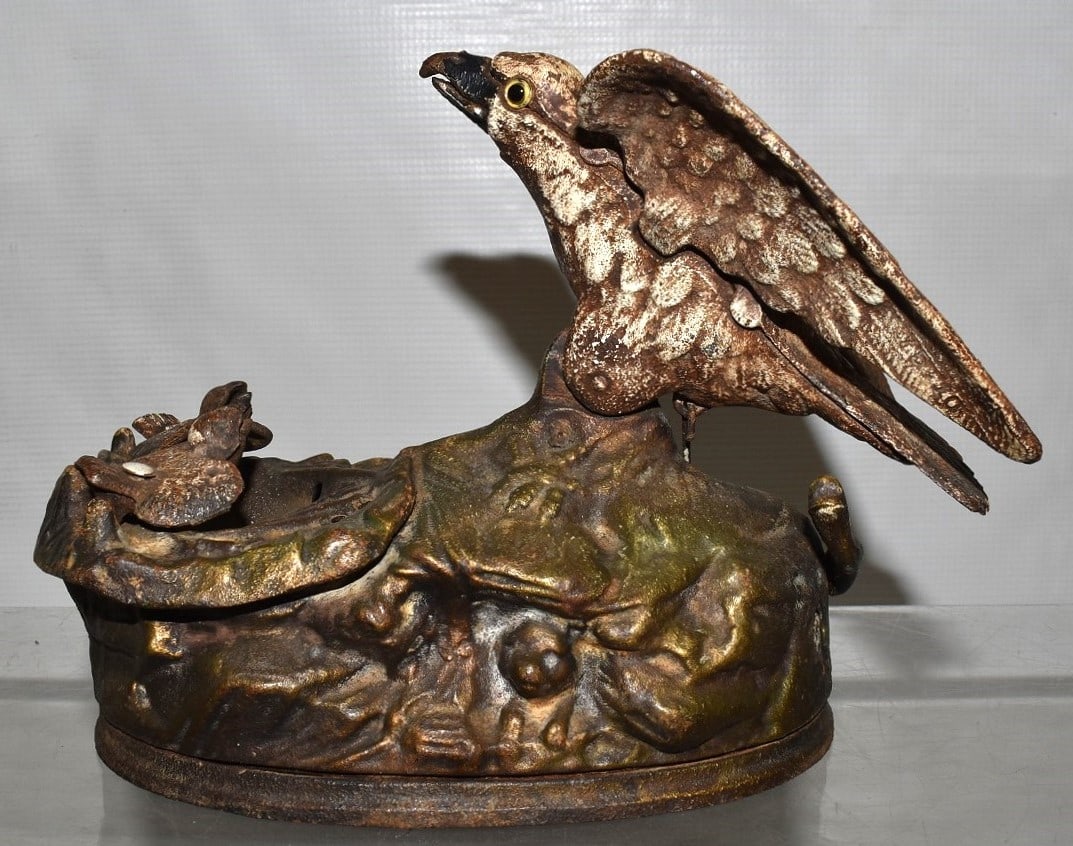 VINTAGE CAST IRON EAGLE & EAGLETS MECHANICAL BANK: VINTAGE CAST IRON EAGLE & EAGLETS MECHANICAL BANK, 20TH C., H. 6 1/2", W. 7"