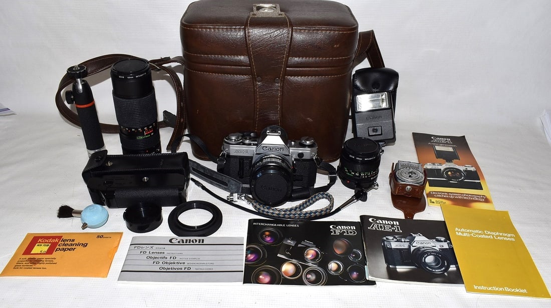 VINTAGE CANON AE-1 35MM CAMERA W/ASST. LENSES, C. 1970: VINTAGE CANON AE-1 35MM CAMERA W/ASST. LENSES, C. 1970