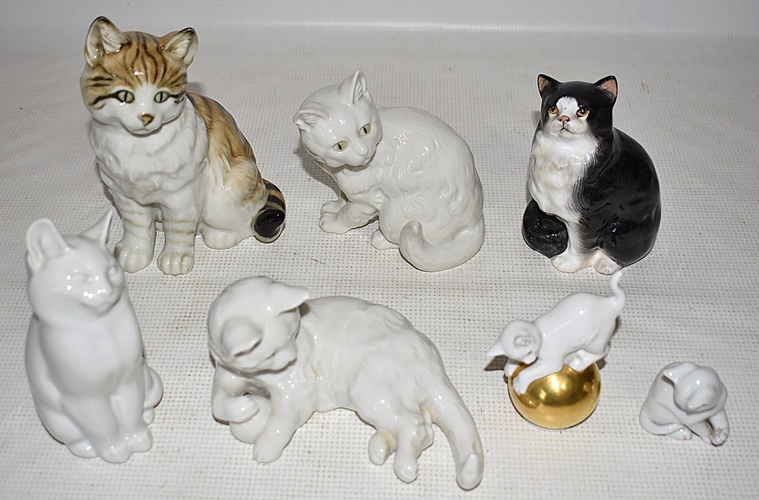 LOT 7 ROYAL COPENHAGEN, R/DOULTON &HUTSCHEN. CAT FIGURE: LOT (7) ROYAL COPENHAGEN, ROYAL DOULTON AND HUTSCHENREUTHER CAT FIGURES; WHITE, BLACK & WHITE ROYAL DOULTON, HUTSCHENREUTHER STRIPED, (2) WHITE WITH GREEN EYES, SMALL ON GOLD BALL, VERY SMALL WHITE,