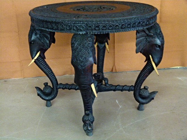 INDIAN CARVED TEAKWOOD CENTER TABLE 19TH C.: ANGLO-INDIAN CARVED SNAKE CHARMER TEAK/ROSEWOOD CENTER TABLE WITH CARVED BONE TUSKS H 25" X D 30"