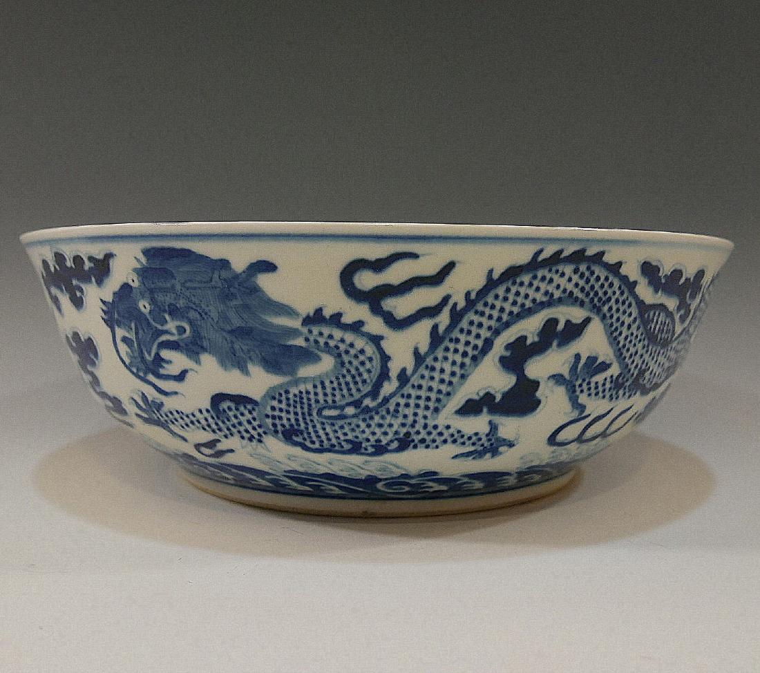 CHINESE IMPERIAL BLUE WHITE DRAGON BOWL - XIANFENG MARK: CHINESE IMPERIAL BLUE WHITE DRAGON BOWL - XIANFENG MARK AND PERIOD. 26.4 CM WIDE. 8.8 CM TALL. PROVENANCE - MARK WALBERG, PA. SOTHEBY'S AUCTION 2004 LOT 124.