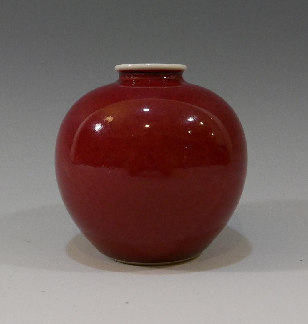 CHINESE ANTIQUE RED GLAZE PORCELAIN WATER POT - KANGXI: CHINESE ANTIQUE RED GLAZE PORCELAIN WATER POT - KANGXI MARK, BUT MADE IN THE LATE QING DYNASTY. 8.6 CM TALL. PROVENANCE - BETHESDA MD ESTATE
